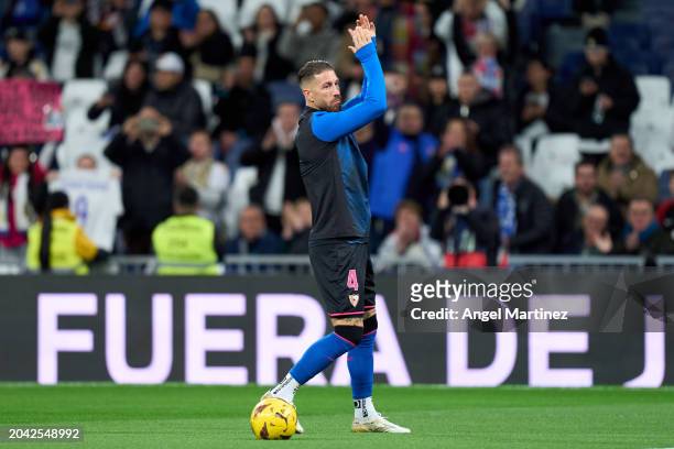 Sergio Ramos of Sevilla FC acknowledges the fans as he warms up prior to the LaLiga EA Sports match between Real Madrid CF and Sevilla FC at Estadio...