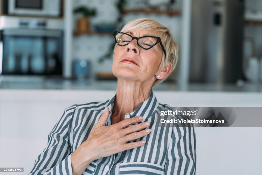 Senior woman having heartache.