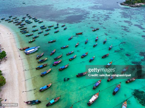 aerial view longtail boats moored on the beach at koh lipe in thailand - ko lipe stock pictures, royalty-free photos & images