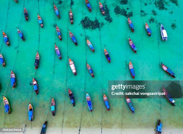 aerial view longtail boats moored on the beach at koh lipe in thailand - ko lipe stock pictures, royalty-free photos & images