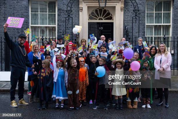 Akshata Murty, the wife of Britain's Prime Minister, Rishi Sunak, poses for photographs with schoolchildren in Downing Street to mark World Book Day...