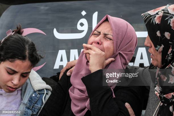 Palestinian woman mourns a relative killed during overnight Israeli bombardment on Deir al-Balah in the central Gaza Strip, at the morgue of the...