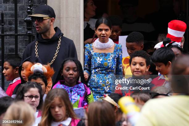 Akshata Murty, the wife of Britain's Prime Minister, Rishi Sunak, poses for photographs with schoolchildren in Downing Street to mark World Book Day...