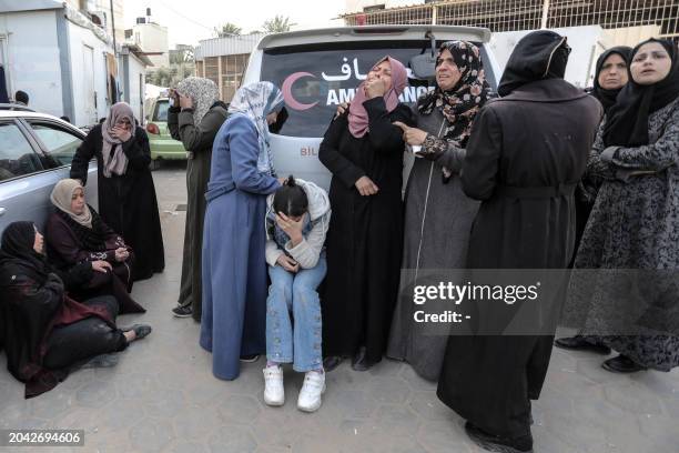 Palestinian women mourn relatives killed during overnight Israeli bombardment on Deir al-Balah in the central Gaza Strip, at the morgue of the...