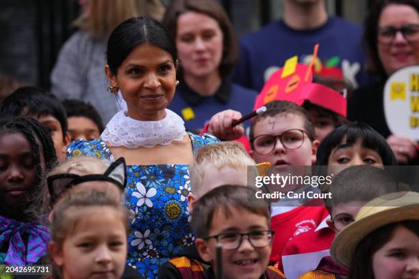 Akshata Murty, the wife of Britain's Prime Minister, Rishi Sunak, poses for photographs with schoolchildren in Downing Street to mark World Book Day...