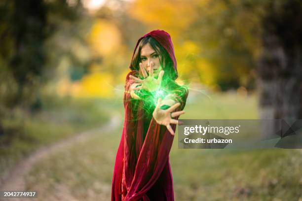 evil witch practicing magic in the forest - cosplay disney stock pictures, royalty-free photos & images