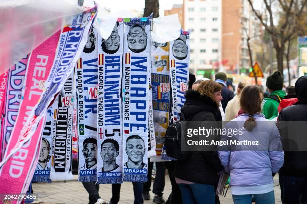 Scarves with the face of Kylian Mbappe are seen for sale outside the stadium prior to the LaLiga EA Sports match between Real Madrid CF and Sevilla...