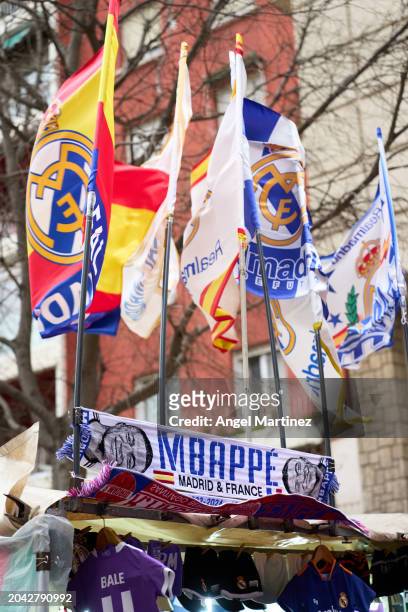 Scarves with the face of Kylian Mbappe are seen for sale outside the stadium prior to the LaLiga EA Sports match between Real Madrid CF and Sevilla...