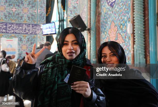 People arrive to cast their votes for 12th term of the parliamentary elections and the 6th term of the Assembly of Leadership Experts at a polling...