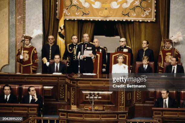 King Juan Carlos of Spain speaking at the opening session of the Spanish parliament in Madrid, Spain, May 9th 1979. At left are Queen Sofia and Crown...