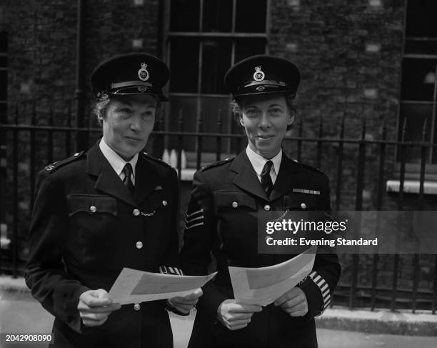 Kathleen Parrott and WSgt Ethel Bush of the Metropolitan Police receiving awards for bravery, London, June 24th 1955. They were both awarded the...