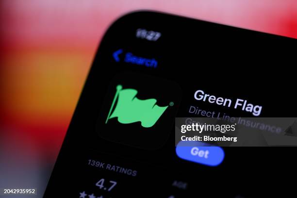 The logo of Green Flag, a brand within Direct Line Insurance Group Plc, displayed on a mobile phone arranged in London, UK, on Friday, March 1, 2024....