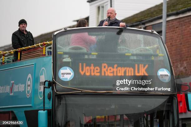 Simon Danczuk, the Reform UK candidate in the Rochdale by-election, campaigns for votes on an open top bus on February 27, 2024 in Rochdale, England....