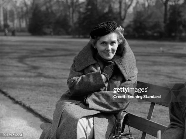 German soprano Elisabeth Schwarzkopf seated on a park bench, March 16th 1955.