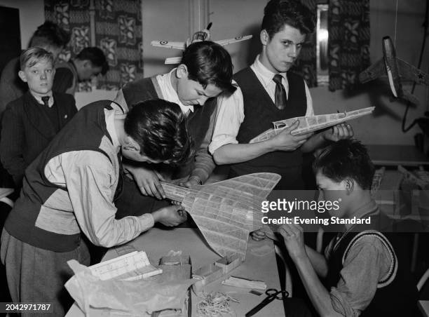 Boys participating in a model aeroplane making class at Brunswick Boys' Club in Fulham, London, March 15th 1955.