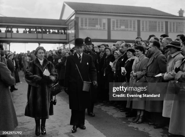 The Queen and John Verney, 20th Baron Willoughby de Broke , at the Cheltenham Gold Cup race meeting at Prestbury Park racecourse, Gloucestershire,...