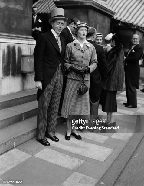 Sir John Junor , editor-in-chief of the Sunday Express, with his wife Pamela, March 11th 1955.