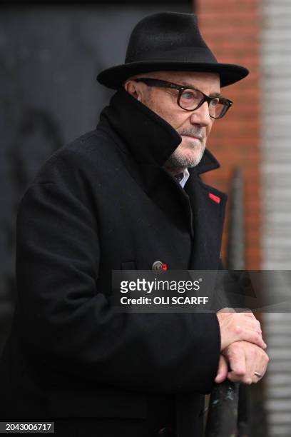 The new Workers Party Member of Parliament for Rochdale, George Galloway poses for a photograph outside his campaign headquarters in Rochdale,...