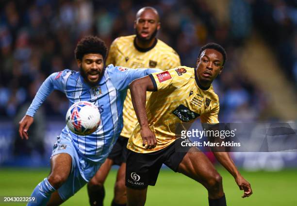 Ellis Simms of Coventry City in action with Raphe Brown of Maidstone United during the Emirates FA Cup Fifth Round match between Coventry City and...