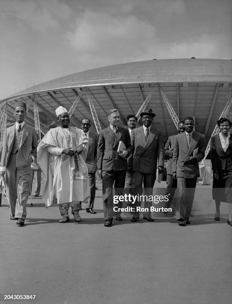 Guide with Chief Adegunle Soetan and others, guests of the UK government under the Colonial Office, at the South Bank Exhibition during the Festival...