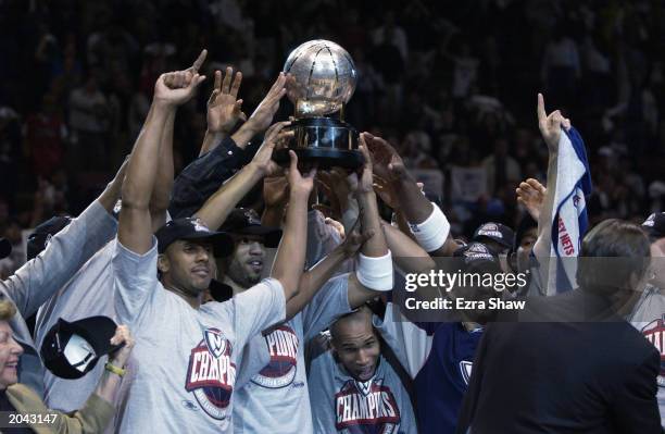 The New Jersey Nets celebrate with the Eastern Conference Championship Trophy after defeating the Detroit Pistons in Game Four of the Eastern...