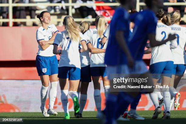 Lotte Wubben-Moy of England celebrates scoring her team's first goal with teammates during the Women's international friendly match between England...