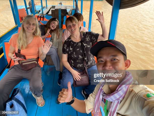 on a water taxi in cambodia - cambodia tourist stock pictures, royalty-free photos & images