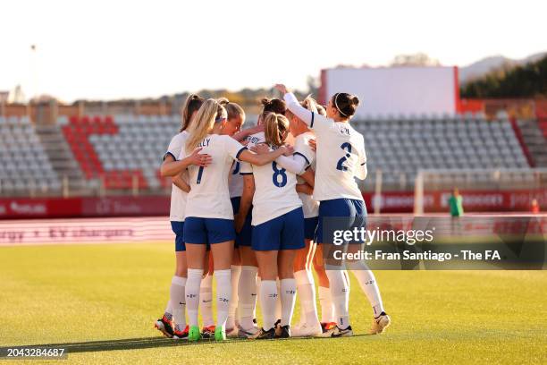 Lotte Wubben-Moy of England celebrates with teammates after scoring her team's first goal during the Women's international friendly match between...