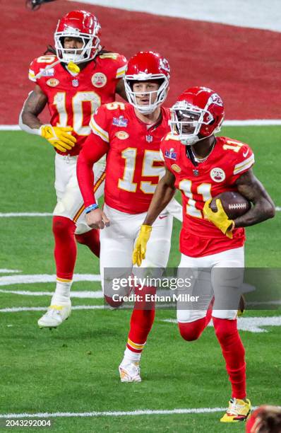 Running back Isiah Pacheco, quarterback Patrick Mahomes and wide receiver Marquez Valdes-Scantling of the Kansas City Chiefs run off the field after...