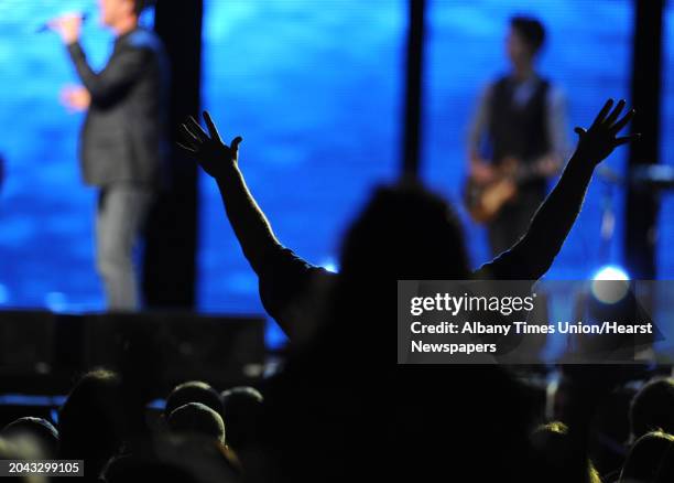 Band plays music in between Joel Osteen preaching to a large crowd at the Times Union Center March 16, 2012 in Albany, N.Y. Osteen is a televangelist...