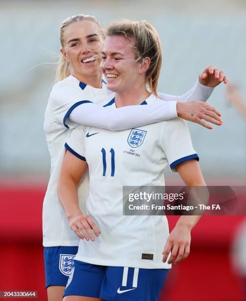 Lauren Hemp of England celebrates scoring her team's third goal with teammate Alex Greenwood during the Women's international friendly match between...