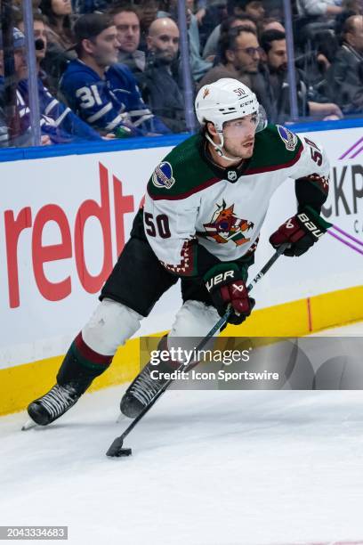 Arizona Coyotes Defenceman Sean Durzi skates with the puck during the NHL regular season game between the Arizona Coyotes and the Toronto Maple Leafs...