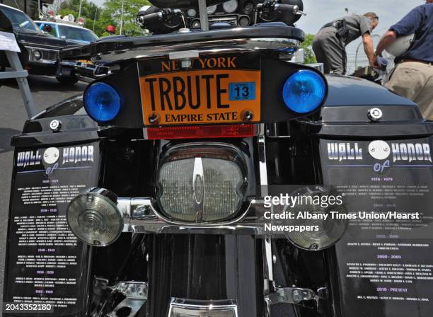 Names on the Wall of Honor are painted on the back of police motorcycle at Spitzie's Motorcycle Center on June 19, 2012 in Colonie, N.Y. A list of...