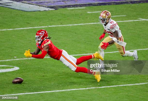 Wide receiver Rashee Rice of the Kansas City Chiefs misses a pass under pressure from safety Logan Ryan of the San Francisco 49ers in the fourth...