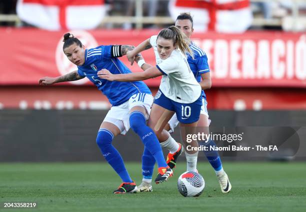 Elena Linari of Italy battles for possession with Grace Clinton of England during the Women's international friendly match between England and Italy...