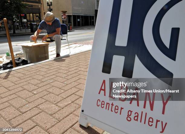 Tony Iadicicco of Albany paints an abstract piece of art on North Pearl street on PARK Day Friday, Sept. 21, 2012 in Albany, N.Y. PARK Day is an...