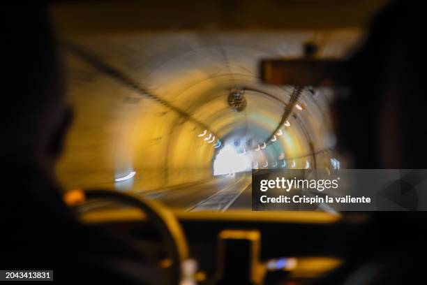 view from inside a car while driving through a tunnel. - light at the end of the tunnel car stock pictures, royalty-free photos & images