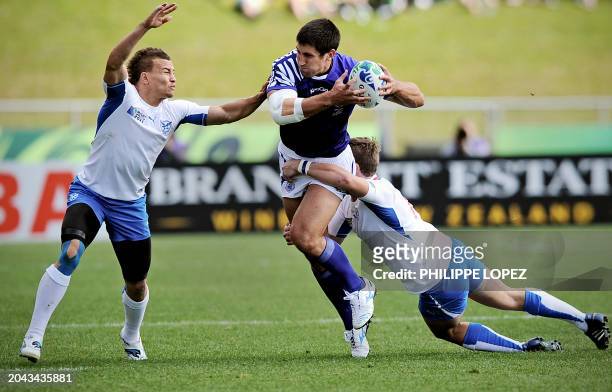 Samoa's Paul Williams is tackled by Namibia's Eugene Janjties as he goes for a try during the 2011 Rugby World Cup pool D match between Samoa and...