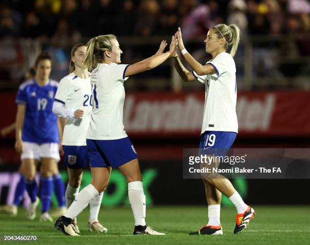 Rachel Daly of England celebrates scoring her team's fifth goal with teammate Lauren Hemp during the Women's international friendly match between...