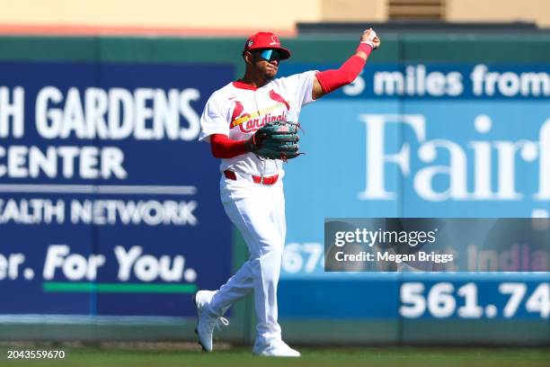 Victor Scott II of the St. Louis Cardinals throws the ball against the Boston Red Sox during the fourth inning of a spring training game at Roger...