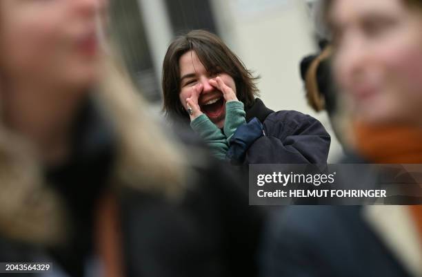 Participant reacts during a protest action organised by The Austrian Women's Ring under the slogan 'Outcry against Femicide' at the Minoritenplatz...