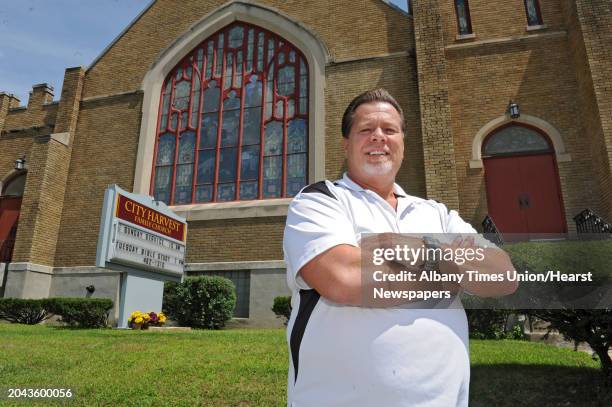 Pastor Ernest Fink stands outside the City Harvest Family Church on Wednesday, July 31, 2013 in Albany, N.Y.