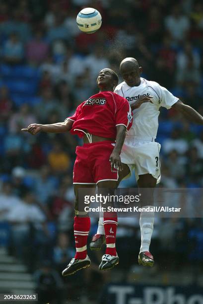 Kevin Lisbie of Charlton Athletic and Julio Cesar of Bolton Wanderers heading during the Premier League match between Bolton Wanderers and Charlton...