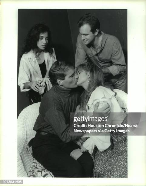 Actors appearing in The Manchurian candidate including Alice Villarreal and Mark Merchant, behind sofa, and Brett Williams and Johnna Foss. Alice...