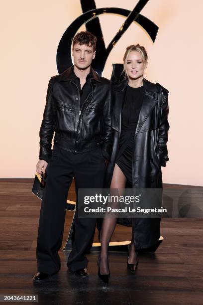 And Niels Schneider and Virginie Efira attend the Saint Laurent Womenswear Fall/Winter 2024-2025 show as part of Paris Fashion Week on February 27,...