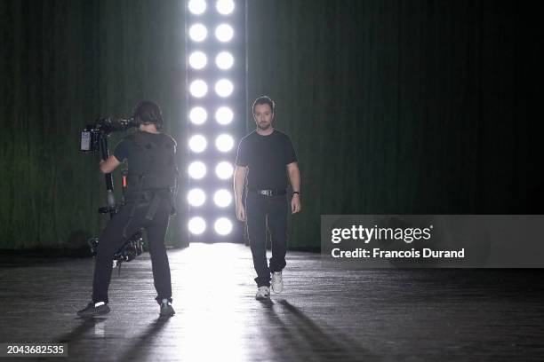 Fashion designer Anthony Vaccarello acknowledges the applause of the audience during the Saint Laurent Womenswear Fall/Winter 2024-2025 show as part...