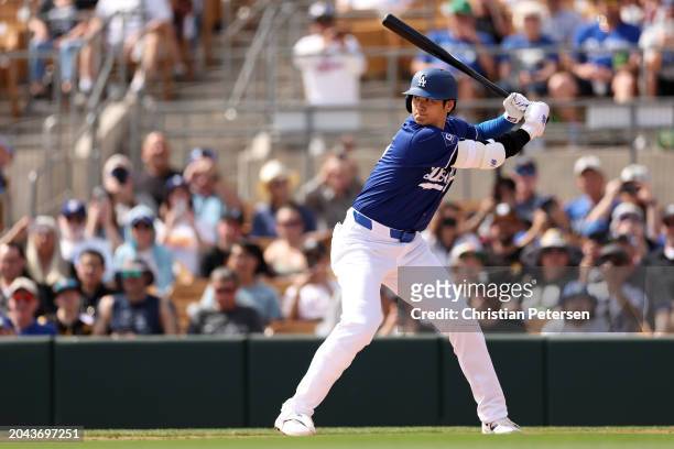 Shohei Ohtani of the Los Angeles Dodgers bats in the first inning during a game against the Chicago White Sox at Camelback Ranch on February 27, 2024...