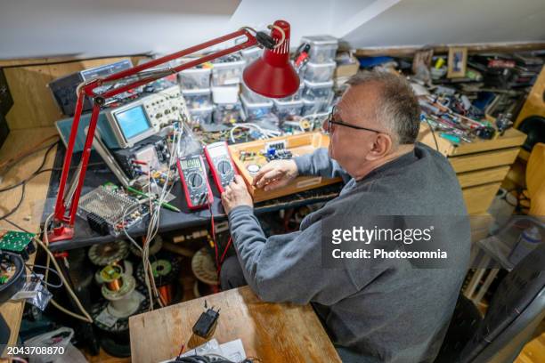 working with electronics at home - concentration camp stock pictures, royalty-free photos & images