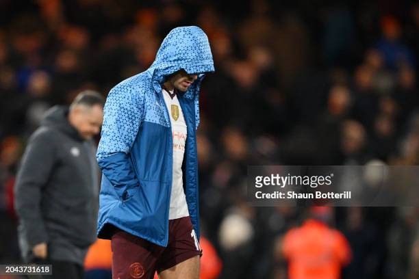 Jack Grealish of Manchester City looks dejected after picking up an injury as he makes his way to the dressing room at the end of the first half...