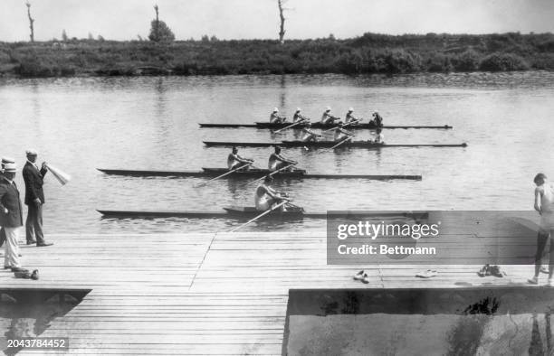 The United States rowing crew in single, doubles, four oar are starting out in trials on the Seine. Photo by Bettmann Archive/Getty Images)